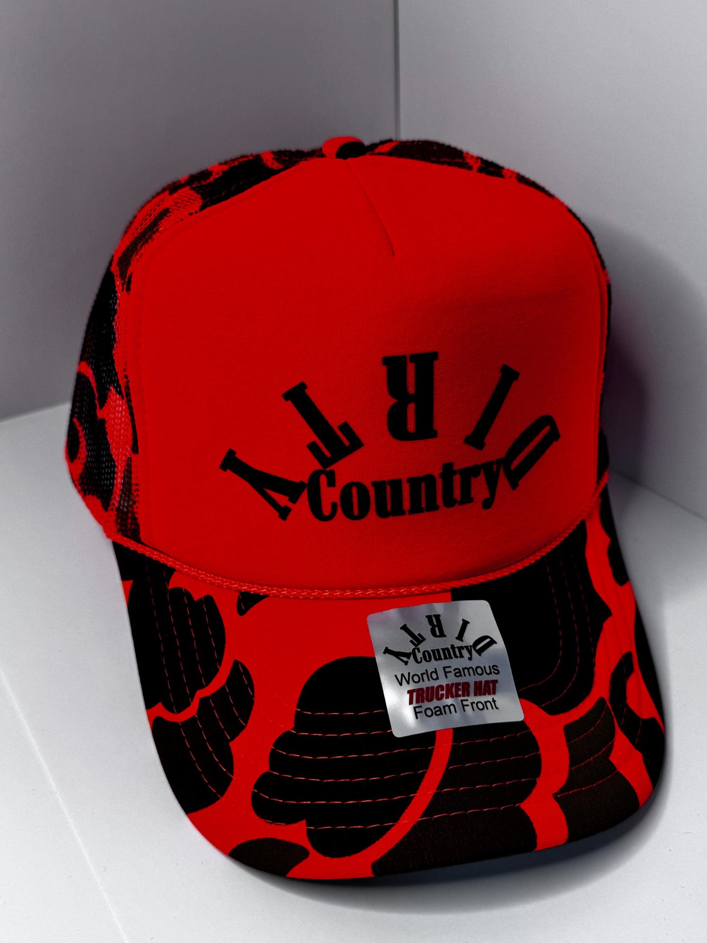 Original Dirty Country Orange Camo Custom Trucker Hat with parody design, Adjustable Snapback Closure, and Ideal for Any Occasion